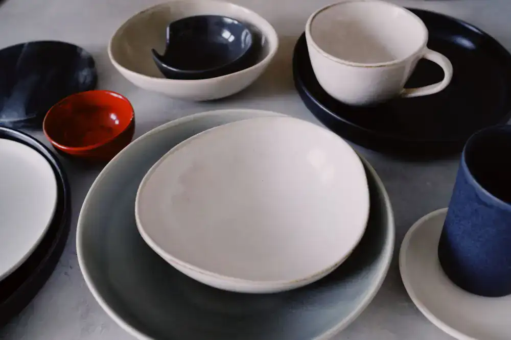 Set of matching handmade stoneware plates and bowls